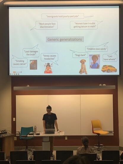 Examples of "generic generalizations" on a presentation slide above Ny Vasil in a lecture hall.