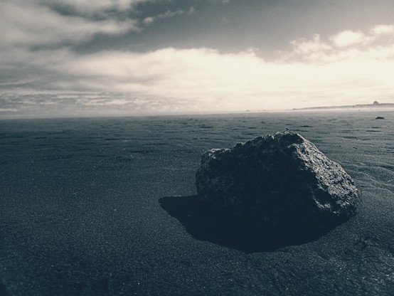 basaltic rock on black sand
