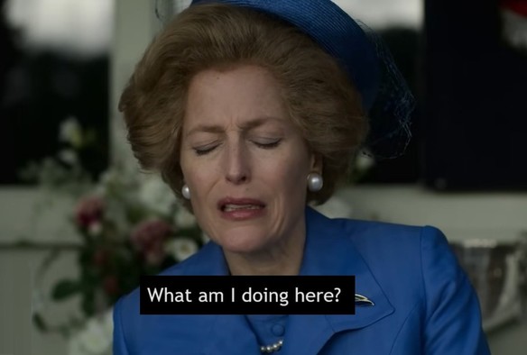 Screenshot from The Crown, in which Thatcher is profoundly uncomfortable being forced to sit and watch Highland games while visiting the Queen at Balmoral. Dialogue caption: What am I doing here?