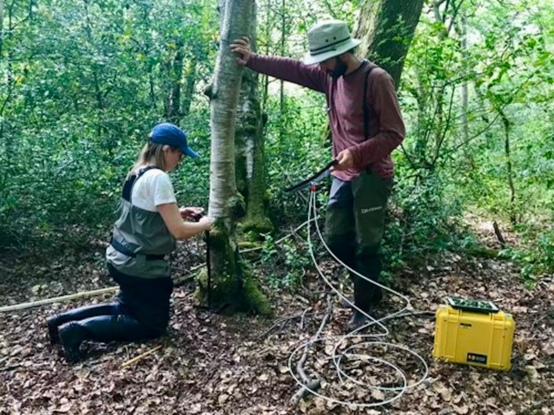 [ImageSource: Vincent Gauci, CC BY-ND]

Positioning a gas exchange chamber on a temperate woodland tree in west Sussex.

Scientists measured methane exchange on hundreds of tree stems in forests along a climate gradient spanning the Amazon and Panama, through to Sweden and forests near Oxford in the UK. She used a simple plastic chamber that wrapped around the tree trunk which was then connected to a laser-based methane analyser.