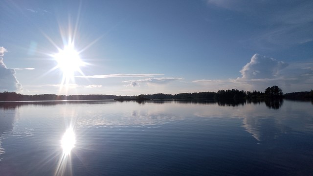 Afternoon sun. Finnish lake 