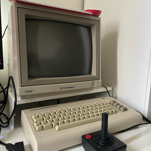 Commodore 64G with a Commodore 1084 monitor. 