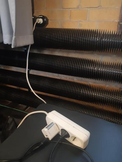 A socket extender is plucked into the rare wall sockets at bUm Berlin.